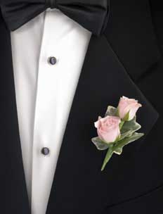 This boutonniere consists of 2 sweetheart pale peach roses and 	3 variegated ivy leaves.
