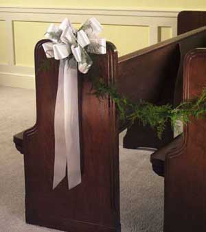 This pew bow contains 10 stems of plumosus and white satin 	ribbon.