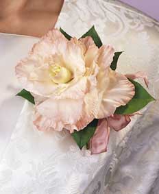This corsage contains flowers such as peach gladiolus, salal 	and peach satin ribbon. 