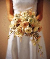 This bouquet contains flowers such as roses, queen anne's lace, dendrobium orchid stem, sweet pea stem, and eucalyptus.