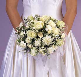 This bouquet contains flowers such as white and
                   cream textured roses, white orchids, white
                   carnations white mini carnations and variegatged
                   greens. 