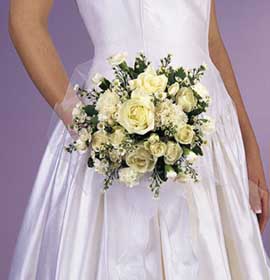 flowers such as  white roses, white spray roses, white mini 	carnations, white monte cassino and variegated greens.